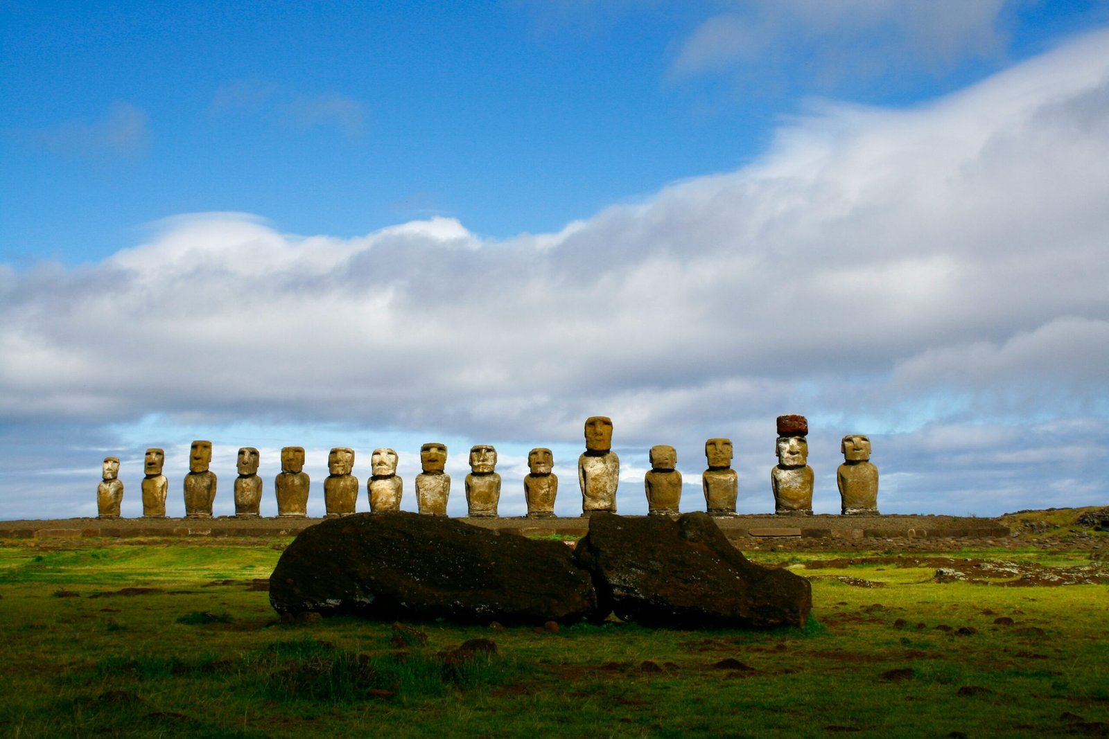 gray rock formation under white clouds and blue sky during daytime