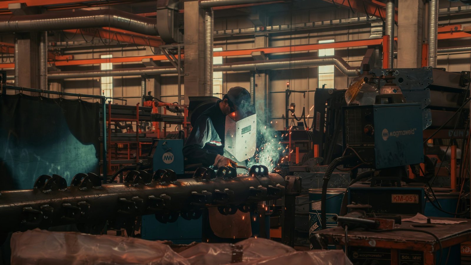 A man working on a machine in a factory