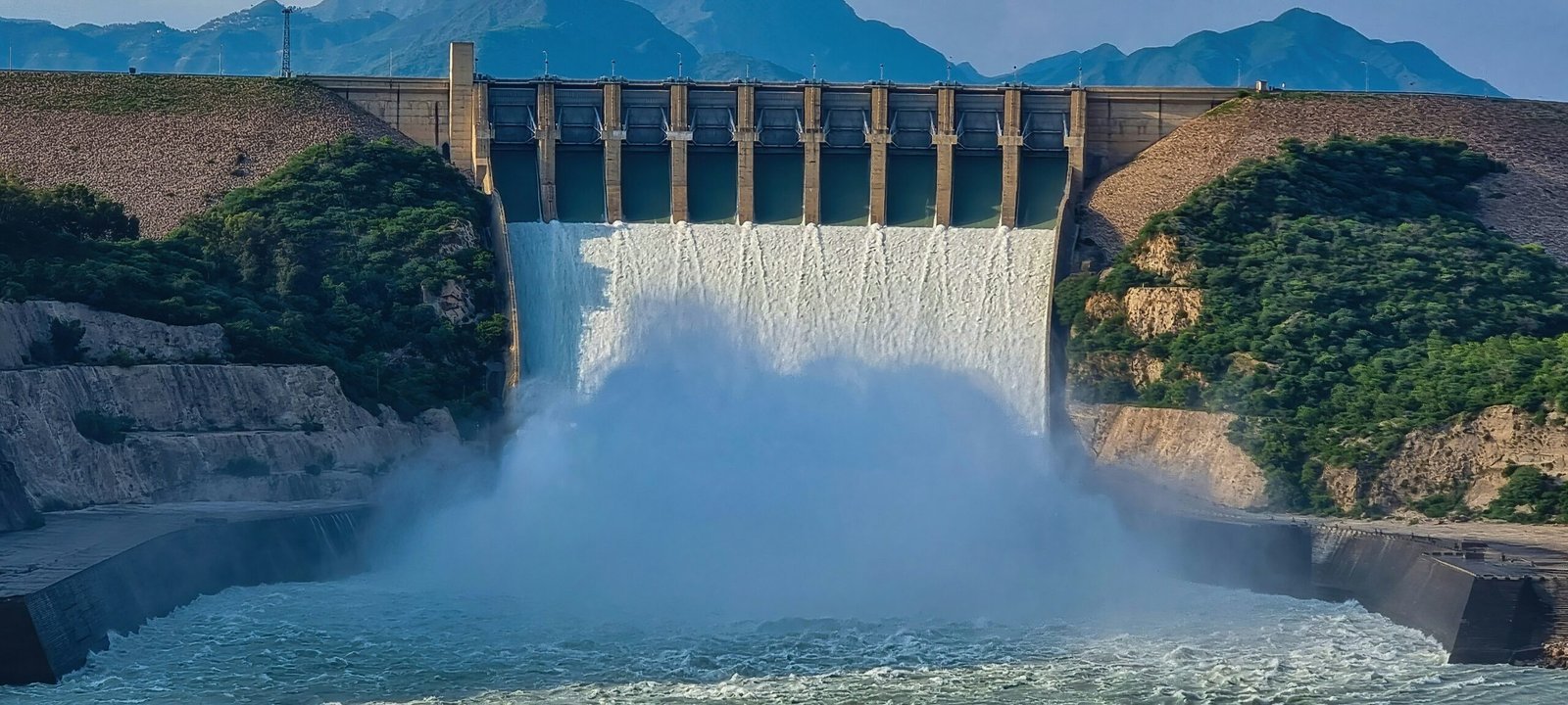 a large dam with water pouring out of it