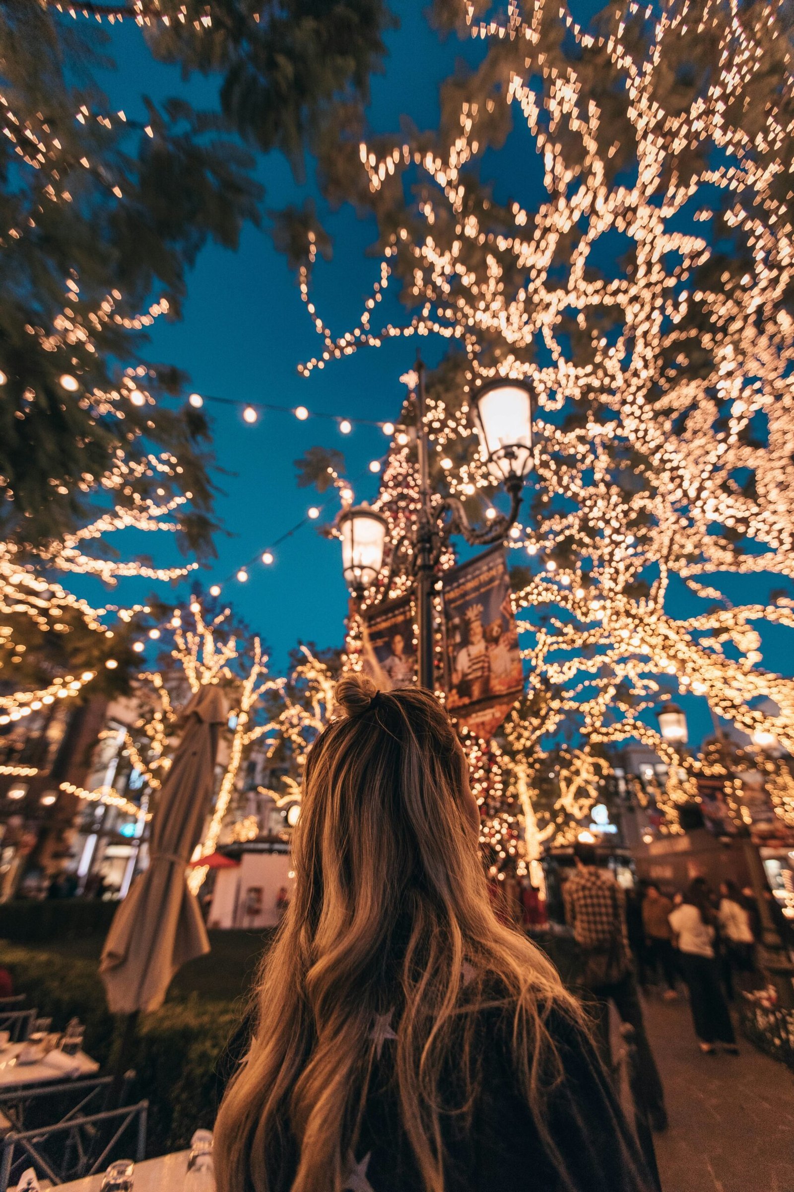 woman seeing string lights